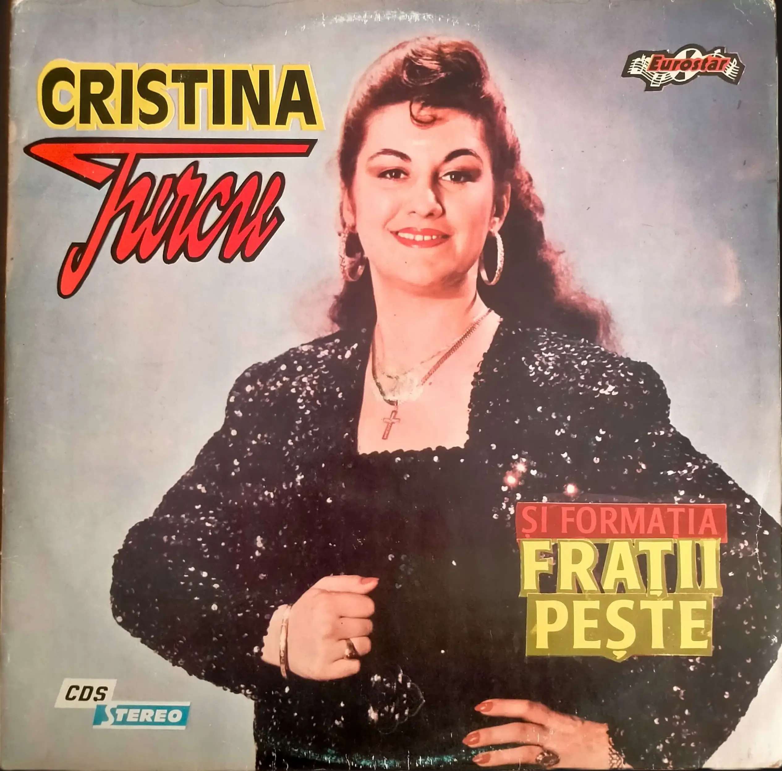 An image of the vinyl album cover by Cristina Turcu (showing herself in a black dress) and the band Fraţii Peşte